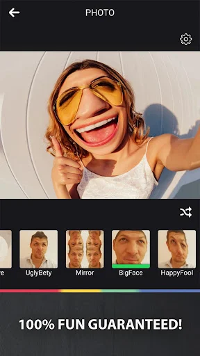 Funny photo booth app showing BigFace effect with yellow sunglasses, UglyBetty and Mirror filter thumbnails